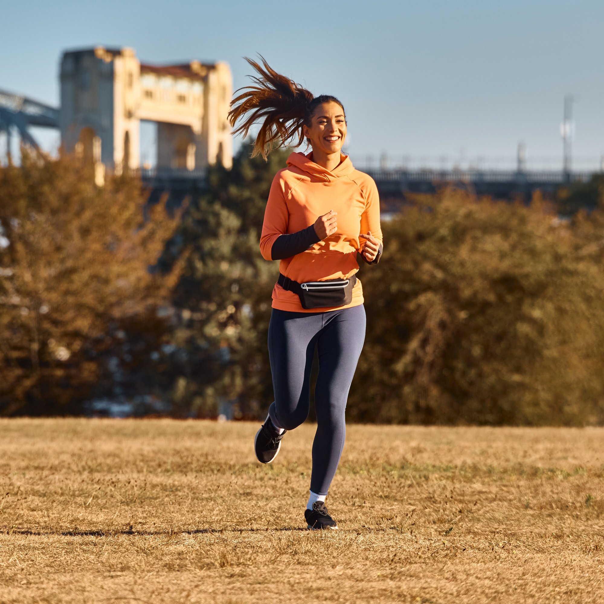 full-length-of-happy-athletic-woman-running-in-the-2024-12-13-18-37-34-utc